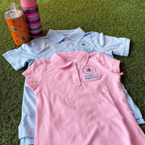 White and pink Fiorella Preparatory School polo uniforms